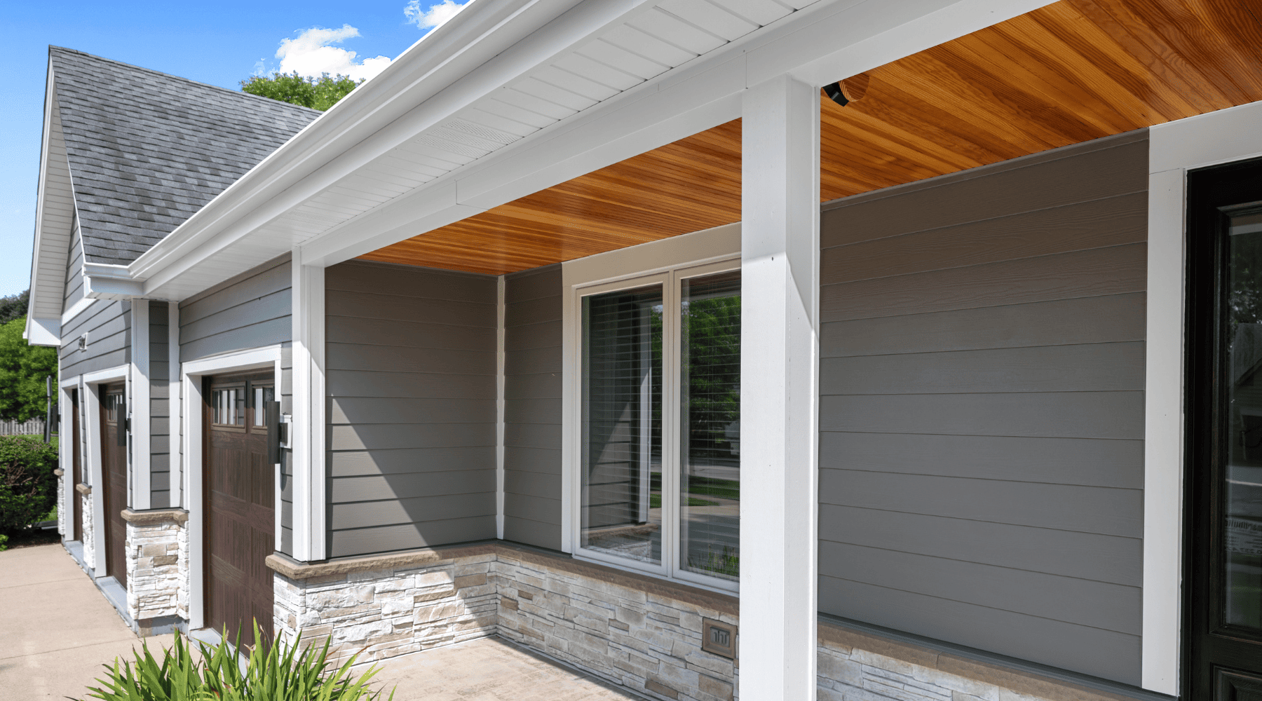 exterior of remodeled naperville home with covered porch and wooden porch ceiling